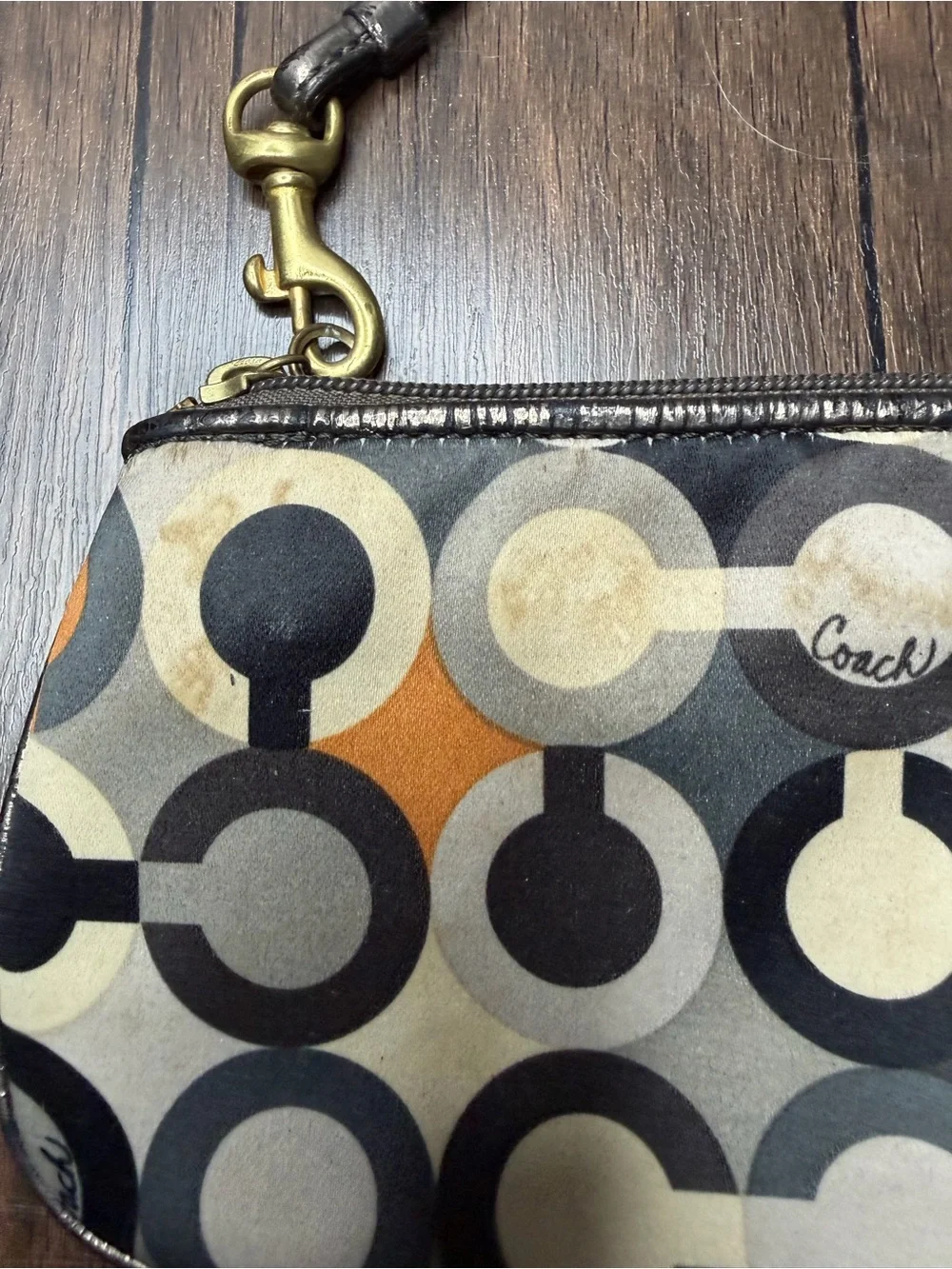 Coach Madison Graphic Op Art sateen Wristlet in Brown and Orange Accents